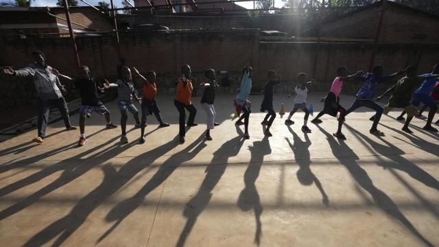 Children practise fencing game, on the outskirts of Kigali, Rwanda, Tuesday, April 4, 2024. The country will commemorate on April 7, 2024 the 30th anniversary of the genocide when ethnic Hutu extremists killed neighbours, friends and family during a three-month rampage of violence aimed at ethnic Tutsis and some moderate Hutus, leaving a death toll that Rwanda puts at 1,000,050. (AP Photo/Brian Inganga) Children practise fencing game, on the outskirts of Kigali, Rwanda, Tuesday, April 4, 2024. The country will commemorate on April 7, 2024 the 30th anniversary of the genocide when ethnic Hutu extremists killed neighbours, friends and family during a three-month rampage of violence aimed at ethnic Tutsis and some moderate Hutus, leaving a death toll that Rwanda puts at 1,000,050. (AP Photo/Brian Inganga)