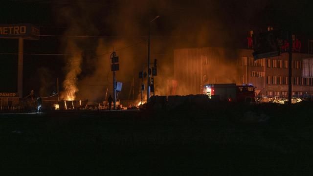 Rescue workers extinguish the fire at the site of a Russian drone attack in Kharkiv, Ukraine, early Saturday April 6, 2024. At least 6 people were killed in Kharkiv in the overnight attacks on Saturday and at least 10 people were injured with blast wounds and shrapnel, said regional governor Oleh Syniehubov. High-rise buildings, a gas station, a shop and a car were damaged. (AP Photo/Alex Babenko) Rescue workers extinguish the fire at the site of a Russian drone attack in Kharkiv, Ukraine, early Saturday April 6, 2024. At least 6 people were killed in Kharkiv in the overnight attacks on Saturday and at least 10 people were injured with blast wounds and shrapnel, said regional governor Oleh Syniehubov. High-rise buildings, a gas station, a shop and a car were damaged. (AP Photo/Alex Babenko)