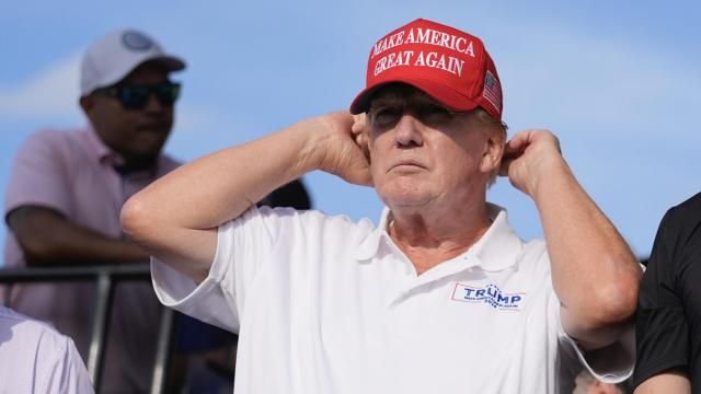 Republican presidential candidate former President Donald Trump adjusts his cap as he watches play on the 18th hole green during the final round of LIV Golf Miami, at Trump National Doral Golf Club, Sunday, April 7, 2024, in Doral, Fla. (AP Photo/Rebecca Blackwell) Republican presidential candidate former President Donald Trump adjusts his cap as he watches play on the 18th hole green during the final round of LIV Golf Miami, at Trump National Doral Golf Club, Sunday, April 7, 2024, in Doral, Fla. (AP Photo/Rebecca Blackwell)