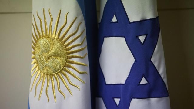 FILE - An Argentine and Israeli flag stand side by side at the office of Guillermo Borger, president of the Jewish community center AMIA, during an interview with The Associated Press in Buenos Aires, Argentina, on Feb. 8, 2013. Argentina’s highest criminal court on Thursday, April 12, 2024, reported a new development in the elusive quest for justice in the country’s deadliest attack in history – the 1994 bombing of a Jewish community center headquarters – concluding Iran had planned the attack and Lebanon’s Hezbollah militant group had executed the plans. (AP Photo/Victor R. Caivano) FILE - An Argentine and Israeli flag stand side by side at the office of Guillermo Borger, president of the Jewish community center AMIA, during an interview with The Associated Press in Buenos Aires, Argentina, on Feb. 8, 2013. Argentina’s highest criminal court on Thursday, April 12, 2024, reported a new development in the elusive quest for justice in the country’s deadliest attack in history – the 1994 bombing of a Jewish community center headquarters – concluding Iran had planned the attack and Lebanon’s Hezbollah militant group had executed the plans. (AP Photo/Victor R. Caivano)