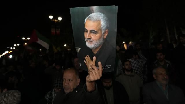 A demonstrator holds up a poster of the late Iranian Revolutionary Guard Gen. Qassem Soleimani, who was killed in a U.S. drone attack in 2020 in Iraq, during an anti-Israeli gathering in front of the British Embassy in Tehran, Iran, early Sunday, April 14, 2024. Iran launched its first direct military attack against Israel on Saturday. (AP Photo/Vahid Salemi) A demonstrator holds up a poster of the late Iranian Revolutionary Guard Gen. Qassem Soleimani, who was killed in a U.S. drone attack in 2020 in Iraq, during an anti-Israeli gathering in front of the British Embassy in Tehran, Iran, early Sunday, April 14, 2024. Iran launched its first direct military attack against Israel on Saturday. (AP Photo/Vahid Salemi)