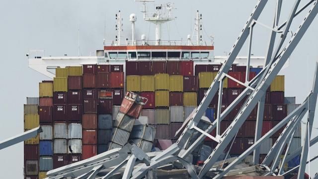 FILE - The container ship Dali is stuck under part of the Francis Scott Key Bridge after the ship hit the bridge, March 26, 2024, in Baltimore, Md. The FBI is conducting a criminal investigation into the deadly collapse of Baltimore’s Francis Scott Key Bridge that is focused on the circumstances leading up to it and whether all federal laws were followed. The FBI says Monday, April 15 it was present conducting court authorized law enforcement activity. (AP Photo/Steve Helber, File) FILE - The container ship Dali is stuck under part of the Francis Scott Key Bridge after the ship hit the bridge, March 26, 2024, in Baltimore, Md. The FBI is conducting a criminal investigation into the deadly collapse of Baltimore’s Francis Scott Key Bridge that is focused on the circumstances leading up to it and whether all federal laws were followed. The FBI says Monday, April 15 it was present conducting court authorized law enforcement activity. (AP Photo/Steve Helber, File)