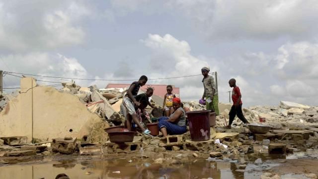 People whose houses were demolished on public health grounds collect water in the Gesco neighborhood of Abidjan, Ivory Coast, Wednesday, Feb. 28, 2024. Rapid urbanisation has led to a population boom and housing shortages in Abidjan, where nearly one in five Ivorians reside, many of them in low-income, crowded communes like the ones in the Gesco and Sebroko districts being demolished on public health grounds. (AP Photo/Diomande Ble Blonde) People whose houses were demolished on public health grounds collect water in the Gesco neighborhood of Abidjan, Ivory Coast, Wednesday, Feb. 28, 2024. Rapid urbanisation has led to a population boom and housing shortages in Abidjan, where nearly one in five Ivorians reside, many of them in low-income, crowded communes like the ones in the Gesco and Sebroko districts being demolished on public health grounds. (AP Photo/Diomande Ble Blonde)