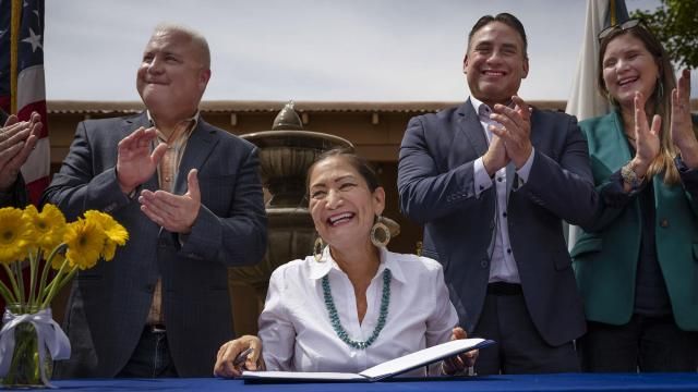 Interior Secretary Deb Haaland smiles after signing Public Land Order 7940, which protects more than 4,200 acres of Bureau of Land Management-managed public lands that is sacred to Tribes in the Placitas area, during a community event at El Zócalo Plaza in Bernalillo, N.M., Thursday, April 18, 2024. For the next 50 years, the lands will be closed to new mining claims, mineral sales, and oil and gas leases. (Chancey Bush/The Albuquerque Journal via AP) Interior Secretary Deb Haaland smiles after signing Public Land Order 7940, which protects more than 4,200 acres of Bureau of Land Management-managed public lands that is sacred to Tribes in the Placitas area, during a community event at El Zócalo Plaza in Bernalillo, N.M., Thursday, April 18, 2024. For the next 50 years, the lands will be closed to new mining claims, mineral sales, and oil and gas leases. (Chancey Bush/The Albuquerque Journal via AP)