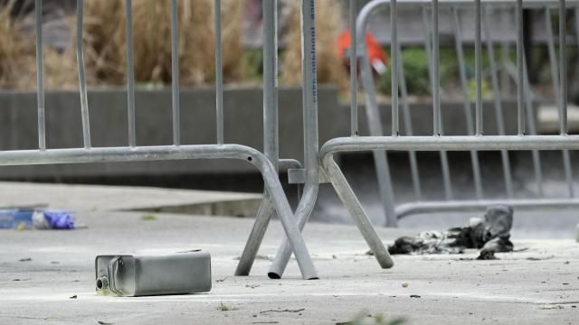 A metal can sits on the ground at the scene where a man lit himself on fire in a park outside Manhattan criminal court, Friday, April 19, 2024, in New York. Emergency crews rushed away a person on a stretcher after fire was extinguished outside the Manhattan courthouse where jury selection was taking place Friday in Donald Trump's hush money criminal case. (AP Photo/Mary Altaffer) A metal can sits on the ground at the scene where a man lit himself on fire in a park outside Manhattan criminal court, Friday, April 19, 2024, in New York. Emergency crews rushed away a person on a stretcher after fire was extinguished outside the Manhattan courthouse where jury selection was taking place Friday in Donald Trump's hush money criminal case. (AP Photo/Mary Altaffer)