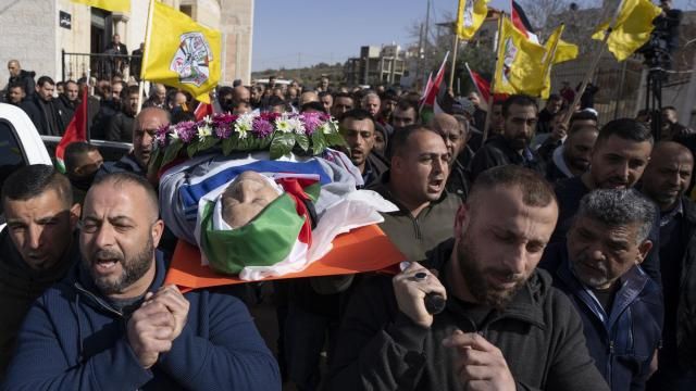 FILE - Mourners carry the body of Omar Assad, during his funeral in the West Bank village of Jiljiliya, north of Ramallah, Thursday, Jan. 13, 2022. Israeli leaders on Sunday, April 21, 2024, harshly criticized an expected decision by the U.S. to impose sanctions on a unit of ultra-Orthodox soldiers in the Israeli military. The unit came under heavy American criticism in 2022 after the elderly Palestinian-American man was found dead shortly after he was detained at a West Bank checkpoint. (AP Photo/Nasser Nasser, File) FILE - Mourners carry the body of Omar Assad, during his funeral in the West Bank village of Jiljiliya, north of Ramallah, Thursday, Jan. 13, 2022. Israeli leaders on Sunday, April 21, 2024, harshly criticized an expected decision by the U.S. to impose sanctions on a unit of ultra-Orthodox soldiers in the Israeli military. The unit came under heavy American criticism in 2022 after the elderly Palestinian-American man was found dead shortly after he was detained at a West Bank checkpoint. (AP Photo/Nasser Nasser, File)