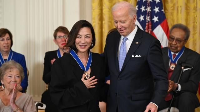 President Joe Biden presents the Presidential Medal of Freedom to Michelle Yeoh, during a ceremony at the White House in Washington, D.C., May 3, 2024. (Kenny Holston/The New York Times)