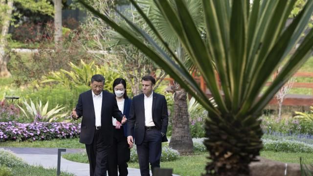 FILE - Chinese President Xi Jinping, left, and French President Emmanuel Macron stroll in the garden of the Guandong province governor's residence, in Guangzhou, China, on April 7, 2023. French President Emmanuel Macron will seek to press China's Xi Jinping to use his influence to move Russia toward ending the war in Ukraine during a two-day state visit to France. Both leaders were also expected to discuss trade disputes over electric cars, cognac and cosmetics. (Jacques Witt/Pool Photo via AP, File) FILE - Chinese President Xi Jinping, left, and French President Emmanuel Macron stroll in the garden of the Guandong province governor's residence, in Guangzhou, China, on April 7, 2023. French President Emmanuel Macron will seek to press China's Xi Jinping to use his influence to move Russia toward ending the war in Ukraine during a two-day state visit to France. Both leaders were also expected to discuss trade disputes over electric cars, cognac and cosmetics. (Jacques Witt/Pool Photo via AP, File)