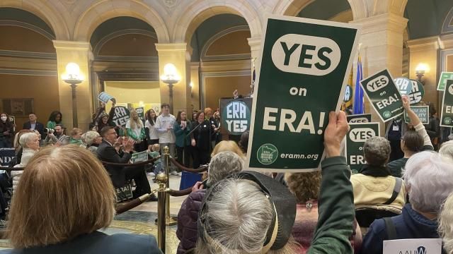 A green sign that says "YES on ERA!" is held by a supporter of the proposed Minnesota Equal Rights Amendment at the Minnesota Capitol building in St. Paul, Minn., Feb. 12, 2024. The proposal would be among the most expansive protections of abortion rights and LGBTQ rights in the nation if it is approved by lawmakers this session and then by Minnesota voters on the 2026 ballot. (AP Photo/Trisha Ahmed) A green sign that says "YES on ERA!" is held by a supporter of the proposed Minnesota Equal Rights Amendment at the Minnesota Capitol building in St. Paul, Minn., Feb. 12, 2024. The proposal would be among the most expansive protections of abortion rights and LGBTQ rights in the nation if it is approved by lawmakers this session and then by Minnesota voters on the 2026 ballot. (AP Photo/Trisha Ahmed)