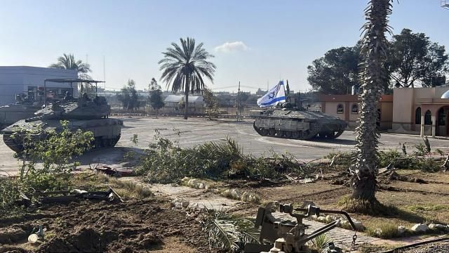 This photo provided by the Israel Defense Forces shows a tank with an Israel flag on it entering the Gazan side of the Rafah border crossing on Tuesday, May 7, 2024. (Israel Defense Forces via AP)