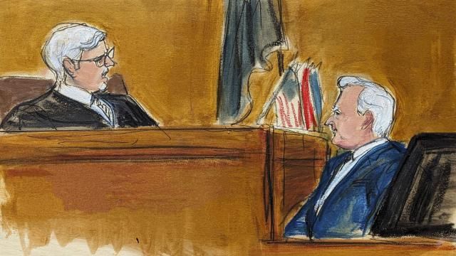 Judge Juan Merchan, left, castigates witness Robert Costello about his "decorum" in the courtroom in Manhattan criminal court, Monday, May 20, 2024, in New York. (Elizabeth Williams via AP)