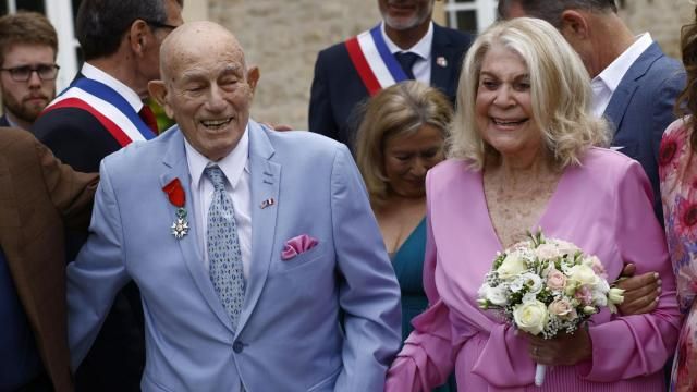 US WWII veteran Harold Terens, 100, left, and Jeanne Swerlin, 96, arrive to celebrate their wedding at the town hall of Carentan-les-Marais, in Normandy, northwestern France, on Saturday, June 8, 2024. Together, the collective age of the bride and groom was nearly 200. But Terens and his sweetheart Jeanne Swerlin proved that love is eternal as they tied the knot Saturday inland of the D-Day beaches in Normandy, France. (AP Photo/Jeremias Gonzalez)