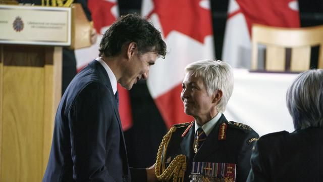 Canada's Prime Minister Justin Trudeau shakes hands with Gen. Jennie Carignan, incoming Chief of the Defence Staff, after her remarks at a change of command ceremony at the Canadian War Museum in Ottawa, on Thursday, July 18, 2024. (Justin Tang/The Canadian Press via AP)