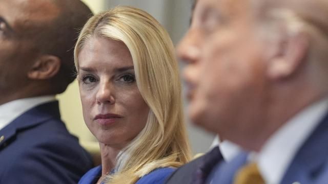 Attorney General Pam Bondi, left, listens as President Donald Trump, right, speaks during a cabinet meeting at the White House, Tuesday, July 8, 2025, in Washington. (AP Photo/Evan Vucci)