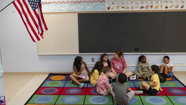 Jillian Murphy leads children in math activities during the East Providence Boys and Girls Club Summer Camp at Emma G. Whiteknact Elementary School on Thursday, July 10, 2025, in Providence R.I. (AP Photo/Sophie Park)