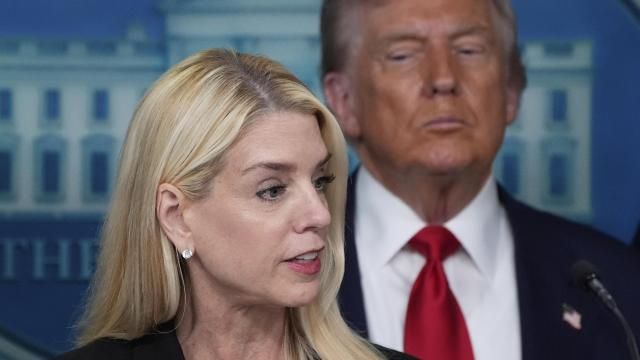 Attorney General Pam Bondi speaks with reporters in the James Brady Press Briefing Room at the White House, Monday, Aug. 11, 2025, in Washington, as President Donald Trump looks on. (AP Photo/Alex Brandon)