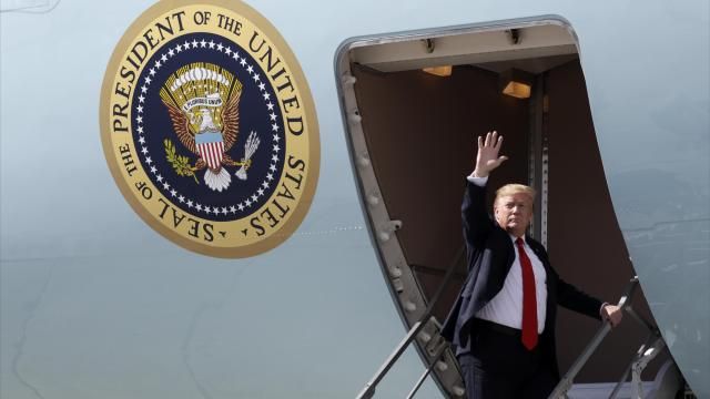 FILE - President Donald Trump waves after greeting troops at Joint Base Elmendorf-Richardson for a refueling stop en route to Japan, May 24, 2019, in Anchorage. (AP Photo/Evan Vucci, File)