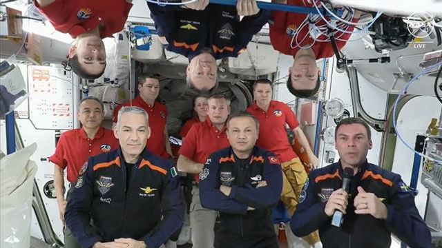 In this image from video provided by NASA, the 11 International Space Station crew members representing Expedition 70 (red shirts) and Axiom Space 3 (dark blue suits) crews gather for a farewell ceremony calling down to mission controllers on Earth on Friday, Feb. 2, 2024. Front row from left are Italy's Walter Villadei, Turkey's Alper Gezeravci and Sweden's Marcus Wandt. Above them hanging upside down in blue is Axiom Space's Michael Lopez-Alegria, a former NASA astronaut. (NASA via AP) In this image from video provided by NASA, the 11 International Space Station crew members representing Expedition 70 (red shirts) and Axiom Space 3 (dark blue suits) crews gather for a farewell ceremony calling down to mission controllers on Earth on Friday, Feb. 2, 2024. Front row from left are Italy's Walter Villadei, Turkey's Alper Gezeravci and Sweden's Marcus Wandt. Above them hanging upside down in blue is Axiom Space's Michael Lopez-Alegria, a former NASA astronaut. (NASA via AP)