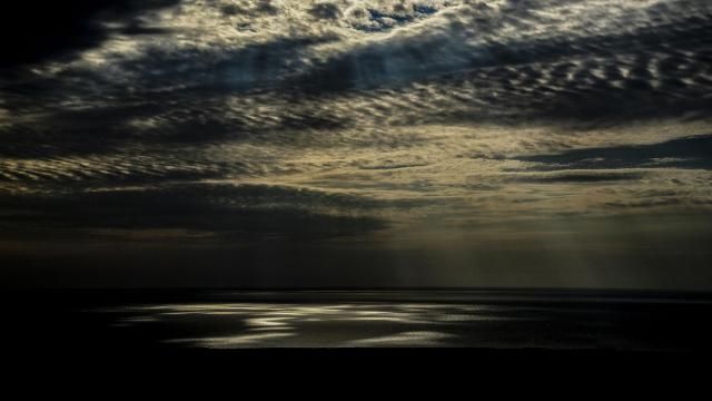 FILE - Light is reflected on part of the Aral Sea outside Muynak, Uzbekistan, June 25, 2023. Researchers at the National Oceanic and Atmospheric Administration and NASA believe if they can inject ice high up in the air, water vapor, water in its gas form, in the upper atmosphere would get a bit drier and that could cool Earth. (AP Photo/Ebrahim Noroozi, File) FILE - Light is reflected on part of the Aral Sea outside Muynak, Uzbekistan, June 25, 2023. Researchers at the National Oceanic and Atmospheric Administration and NASA believe if they can inject ice high up in the air, water vapor, water in its gas form, in the upper atmosphere would get a bit drier and that could cool Earth. (AP Photo/Ebrahim Noroozi, File)