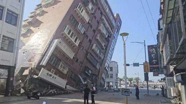 In this image taken from a video footage run by TVBS, a partially collapsed building is seen in Hualien, eastern Taiwan on Wednesday, April 3, 2024. A powerful earthquake rocked the entire island of Taiwan early Wednesday, collapsing buildings in a southern city and creating a tsunami that washed ashore on southern Japanese islands. (TVBS via AP) In this image taken from a video footage run by TVBS, a partially collapsed building is seen in Hualien, eastern Taiwan on Wednesday, April 3, 2024. A powerful earthquake rocked the entire island of Taiwan early Wednesday, collapsing buildings in a southern city and creating a tsunami that washed ashore on southern Japanese islands. (TVBS via AP)