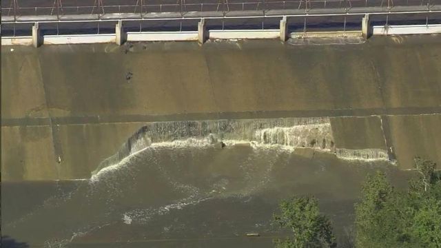 Raw: Part of Wood Lake dam crumpled under water's force