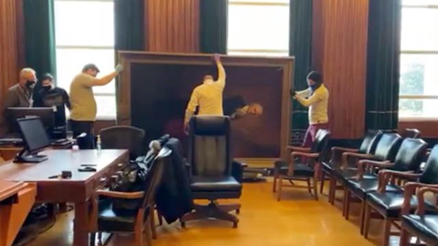 Court workers take down portrait of former NC chief justice