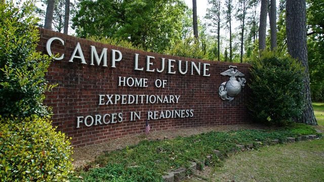 FILE - Signage stands on the main gate to Camp Lejeune Marine ba<em></em>se outside Jacksonville, N.C., on April 29, 2022. A Marine was killed in a homicide at Camp Lejeune on Wednesday night, Oct. 18, 2023, and a second Marine was held on suspicion of being involved, the ba<em></em>se said. (AP Photo/Allen G. Breed, File)
