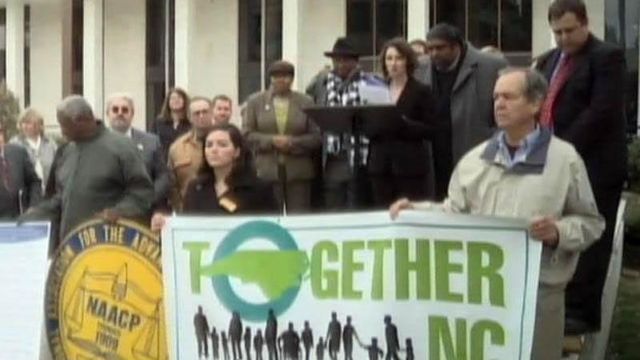 Groups rally against drastic budget cuts