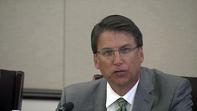 Defiant McCrory battles lawmakers for control