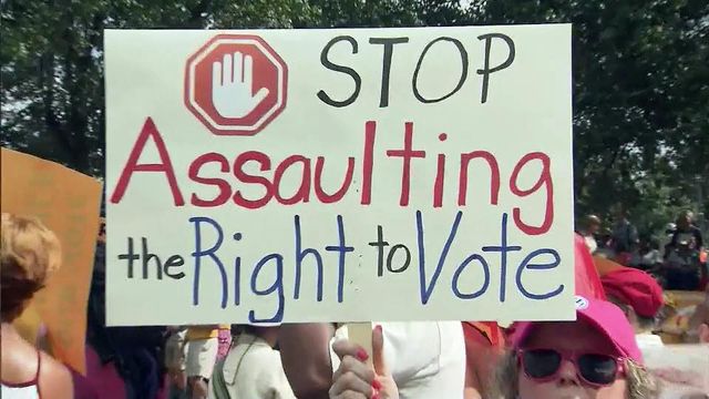Hundreds rally for voting rights as trial over NC law begins