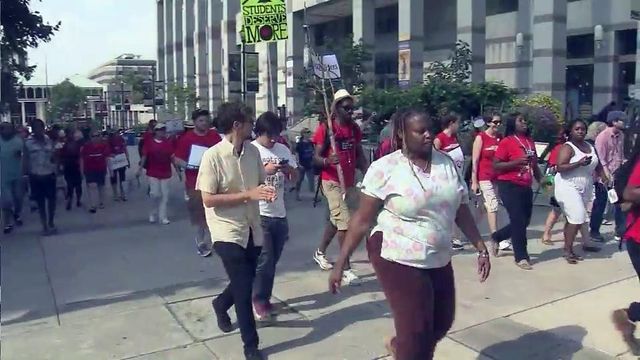 Dozens of teachers march for school funding