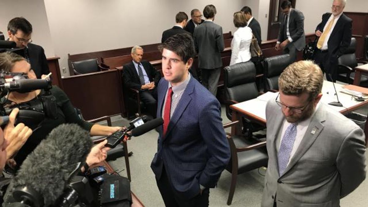 Chris Anglin speaks with reporters post hearing.