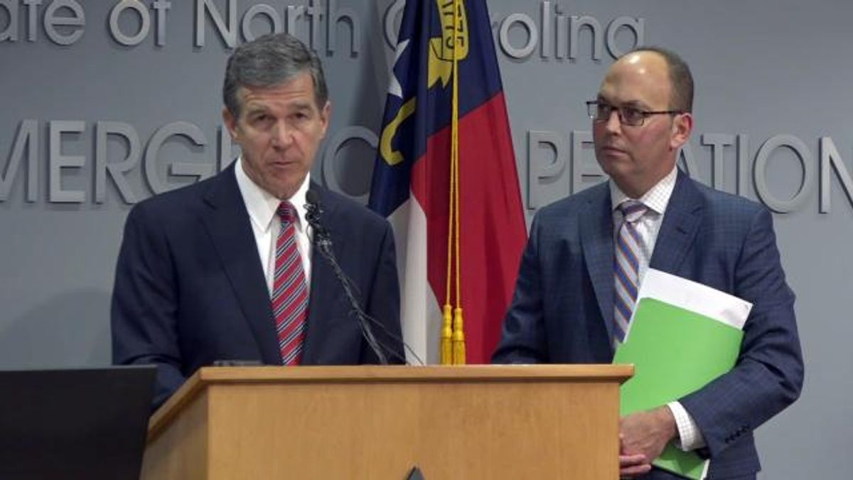 Gov. Roy Cooper with budget director Charlie Perusse