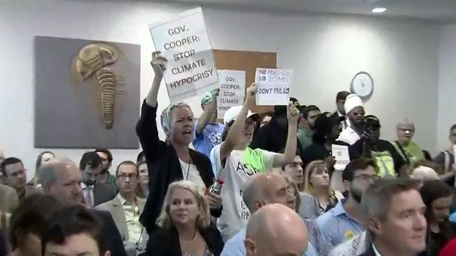 Protesters disrupt meeting on Cooper climate change plan