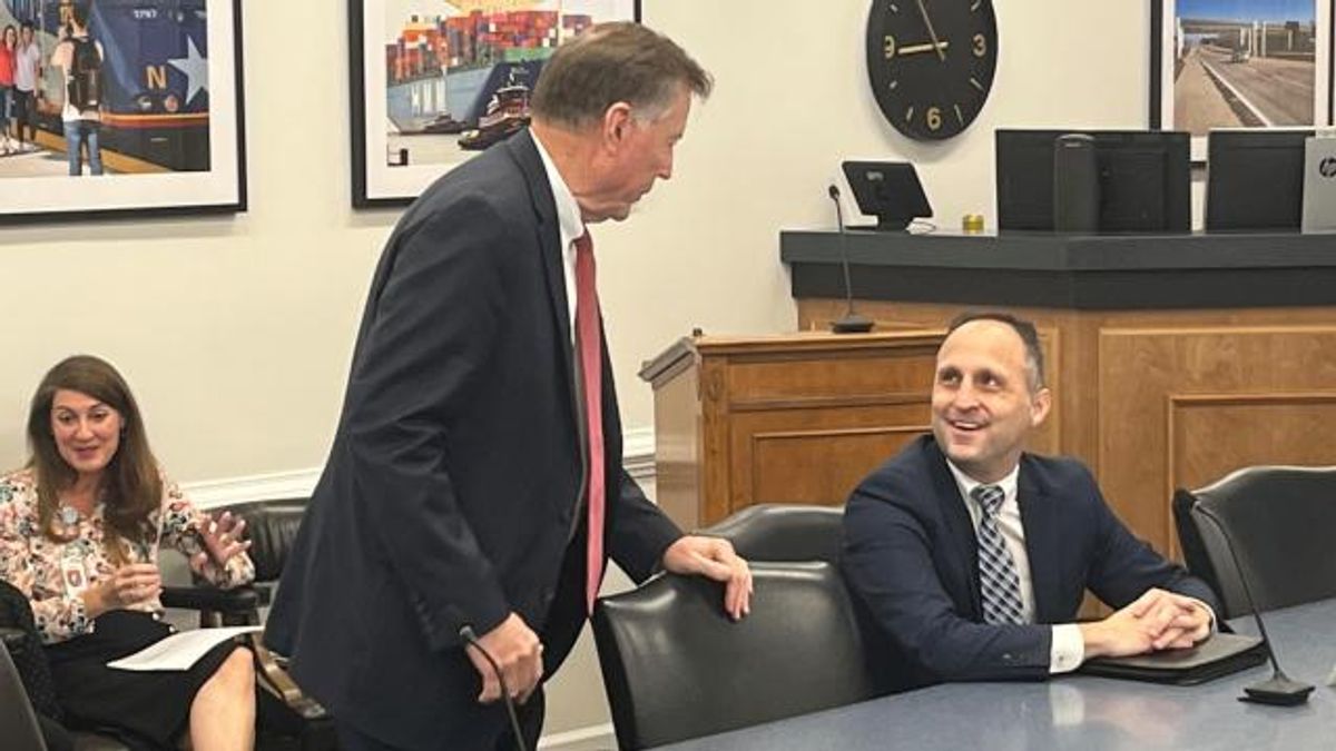 NC Labor Commissioner Josh Dobson looks up at Insurance Commissioner Mike Causey. Dobson announced Tuesday that he won't seek a second term.