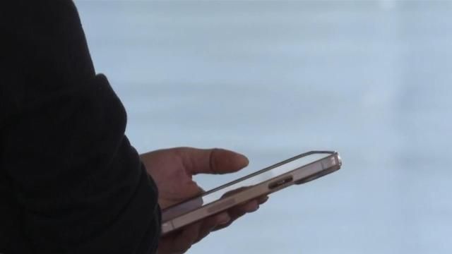 Guy texting on smartphone