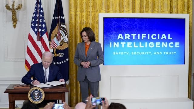 FILE - President Joe Biden signs an executive on artificial intelligence in the East Room of the White House, Oct. 30, 2023, in Washington. Vice President Kamala Harris looks on at right. The White House said Wednesday, Feb. 21, 2024, that it is seeking public comment on the risks and benefits of having an AI system's key components publicly available for anyone to use and modify. (AP Photo/Evan Vucci, File) FILE - President Joe Biden signs an executive on artificial intelligence in the East Room of the White House, Oct. 30, 2023, in Washington. Vice President Kamala Harris looks on at right. The White House said Wednesday, Feb. 21, 2024, that it is seeking public comment on the risks and benefits of having an AI system's key components publicly available for anyone to use and modify. (AP Photo/Evan Vucci, File)