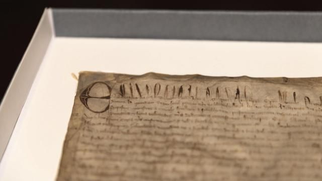 This photo provided by Harvard Law School shows a rare copy of the Magna Carta from 1300 sits in a display case on April 15, 2025, at Harvard Law School in Cambridge, Mass. (Lorin Granger/Harvard Law School via AP)