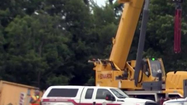 Crane used to pull truck from Nash creek