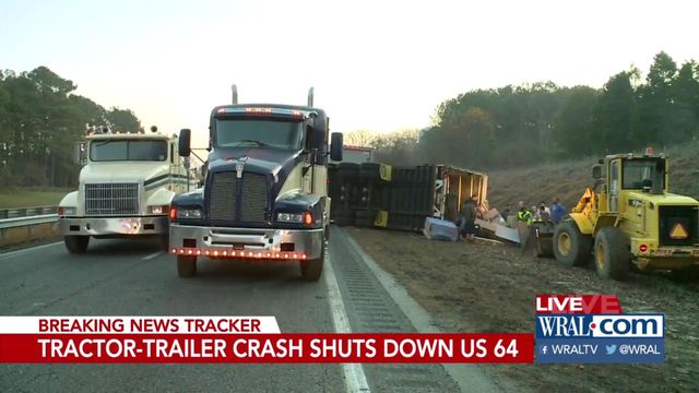 Crews remove overturned tractor trailer from US-64