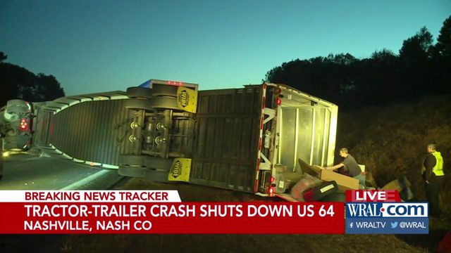 Truck carrying packages overturns, closing US-64 for hours