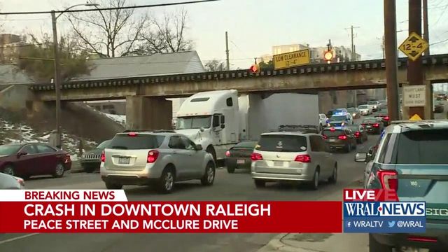Another truck stuck under Raleigh bridge