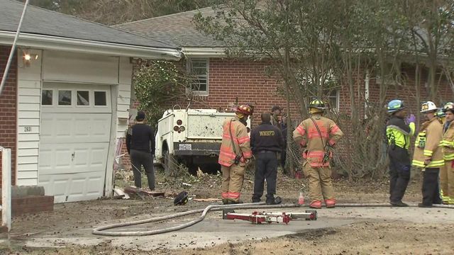 Car stuck in house on Raleigh's New Hope Road