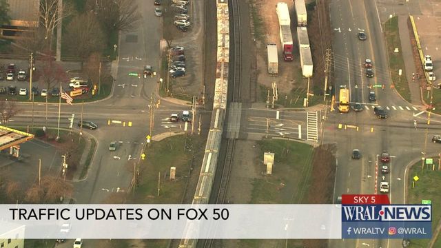 Sky 5 flies over stalled train near State Fairgrounds