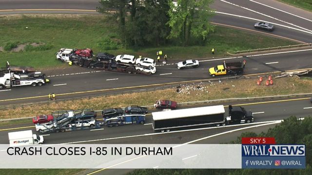Sky 5: Tractor trailer transporting cars overturns in Durham
