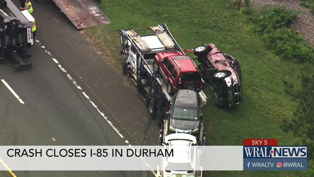 Traffic backed up for 3 miles after truck carrying cars overturns on I-85