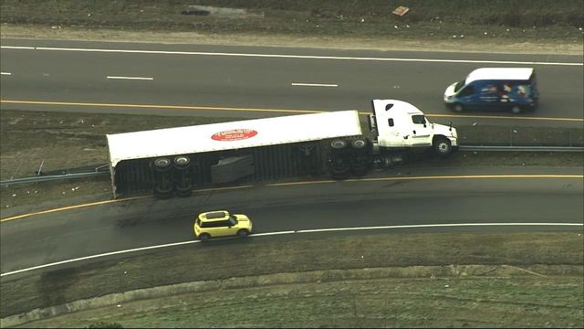 18-wheeler on its side near New Bern Ave. and I-440