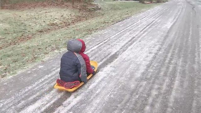 Icy streets draw brave to sleds