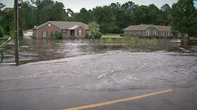 Flood waters hem in Wilmington neighborhoods