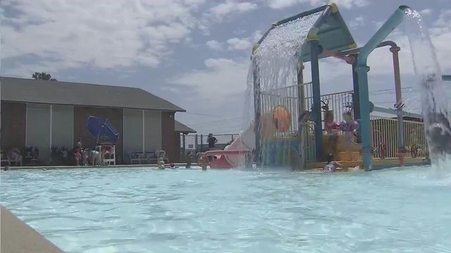 Fayetteville residents stay inside, hit the pool to cool off